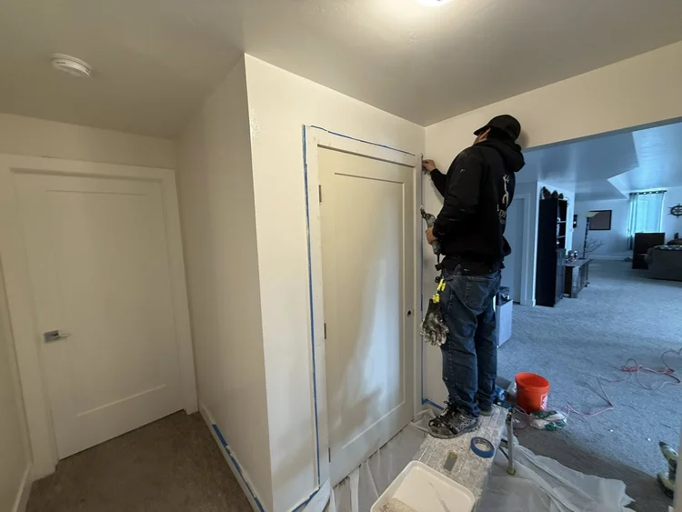 Peak Trades Group crew member finishing interior trim and paint