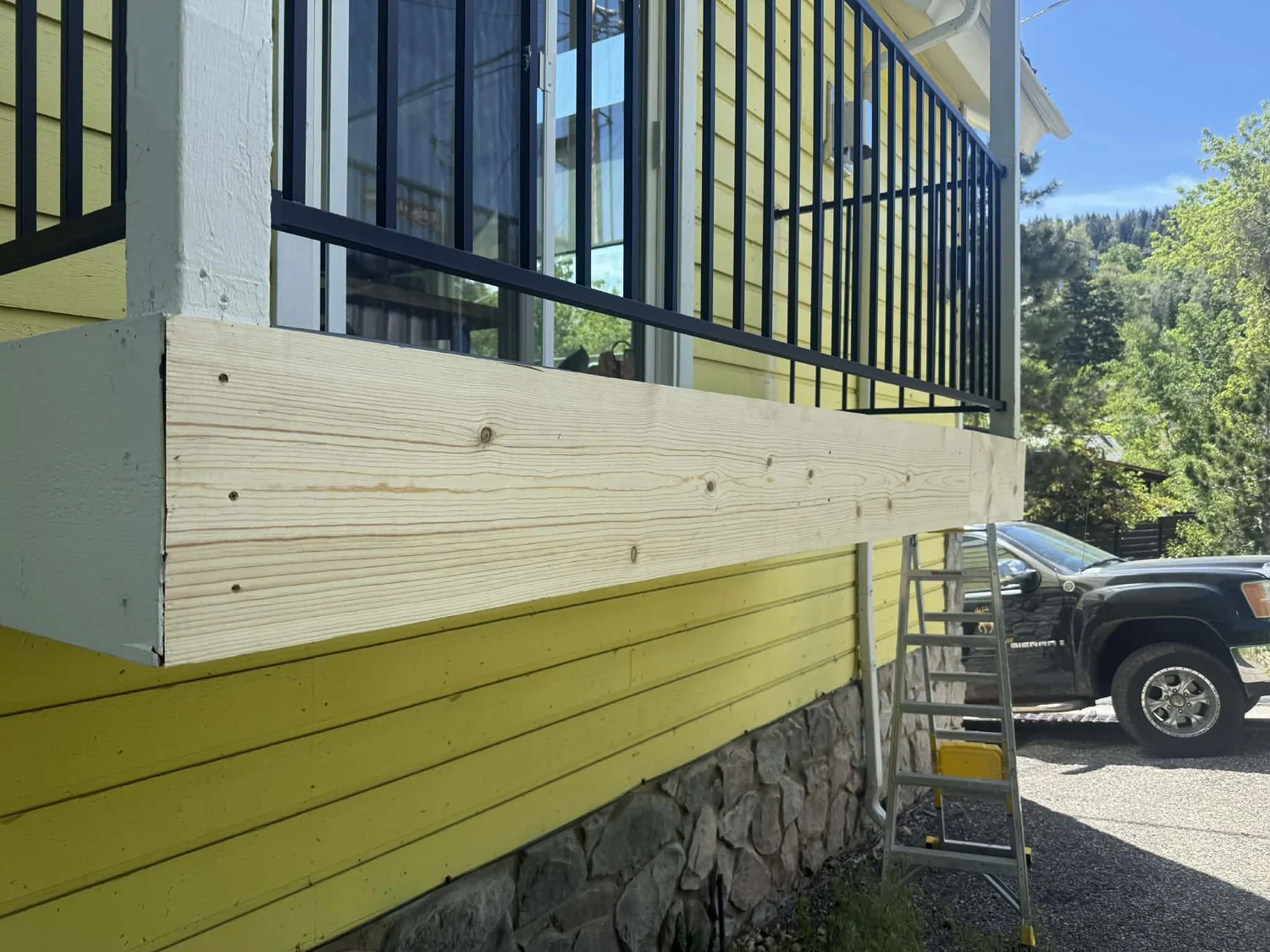 New framing and rim board fitted during exterior deck repair