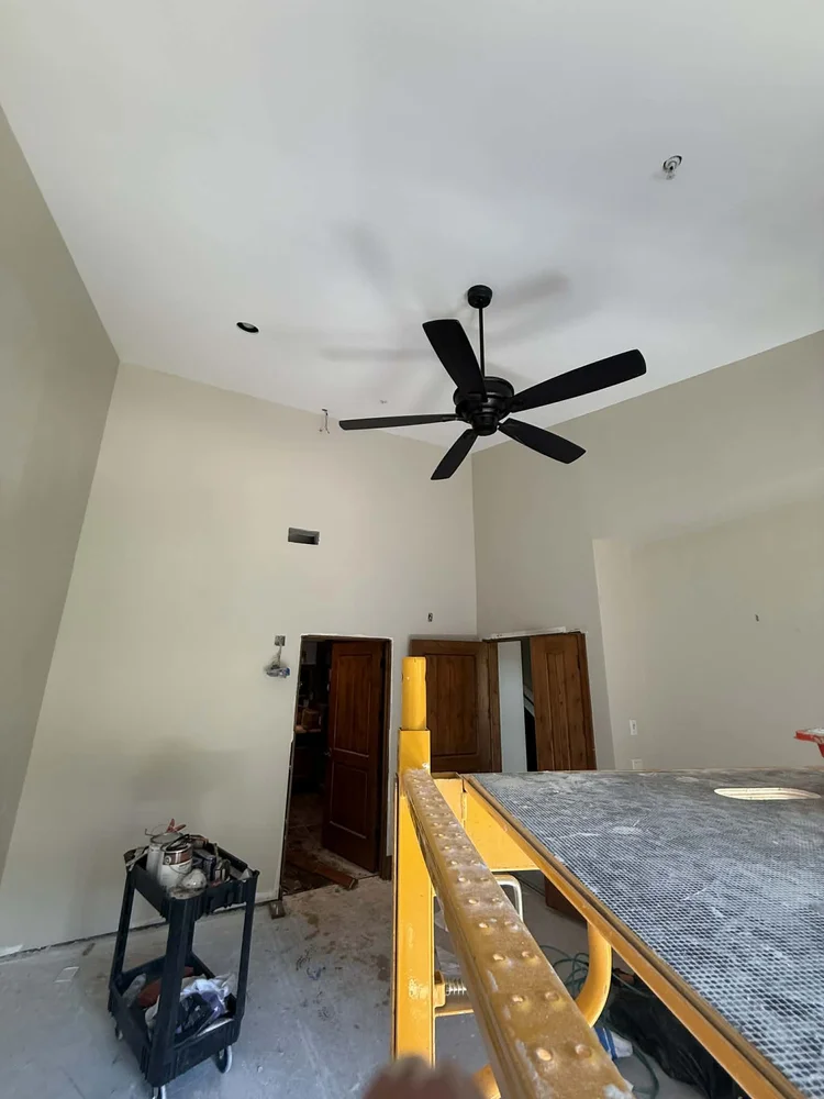 Finished walls and vaulted ceiling nearing completion on an interior remodel